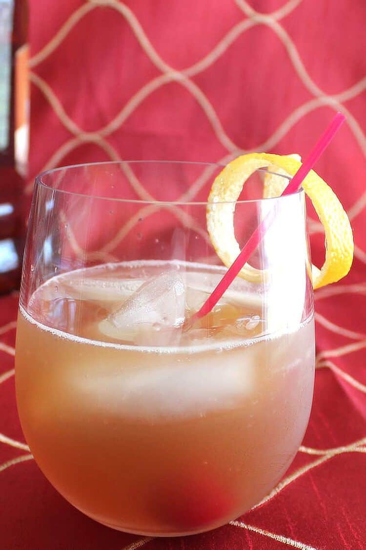 Amaretto Sour cocktail Amaretto Sour cocktail with lemon twist and cherry