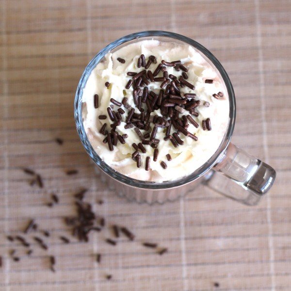 Overhead view of Cafe Nelson drink with whipped cream and chocolate sprinkles