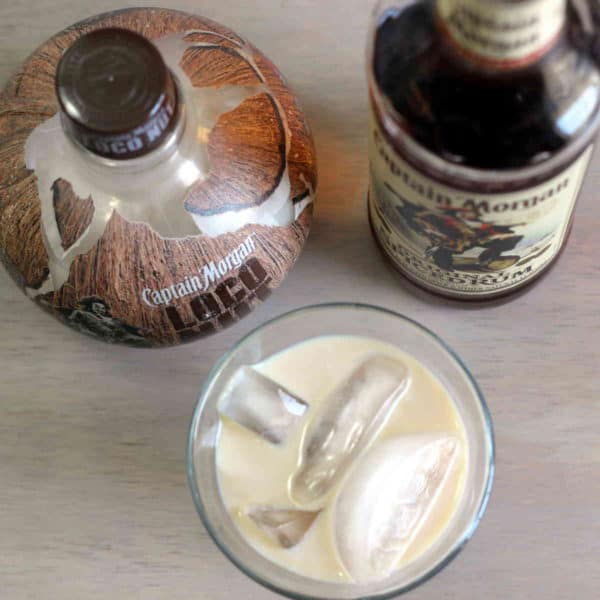 Overhead shot of Captain & Loco cocktail and two liquor bottles