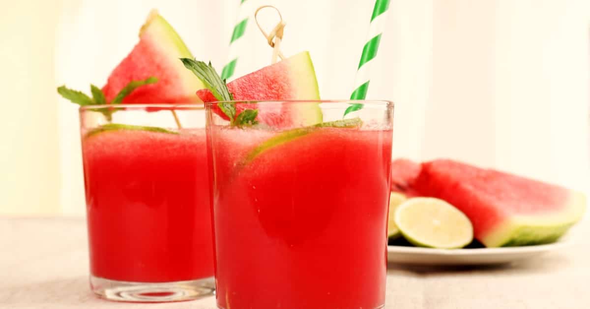 Fresh Watermelon 'Rita on picnic table in front of plate of watermelon