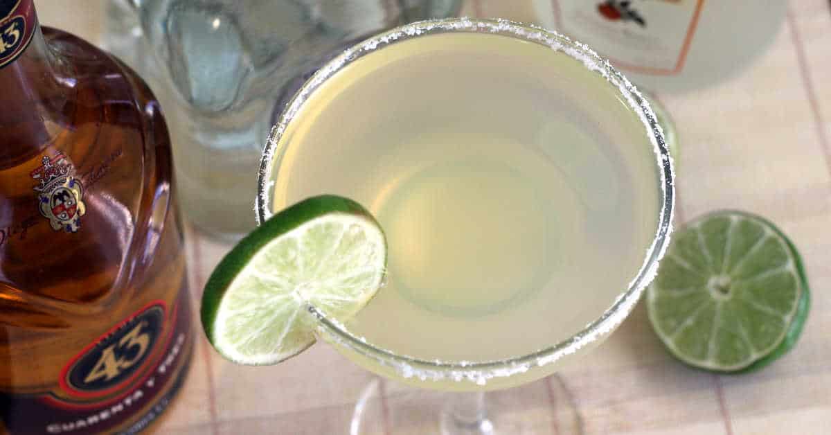 Overhead view of Honey Vanilla Margarita in front of liquor bottles