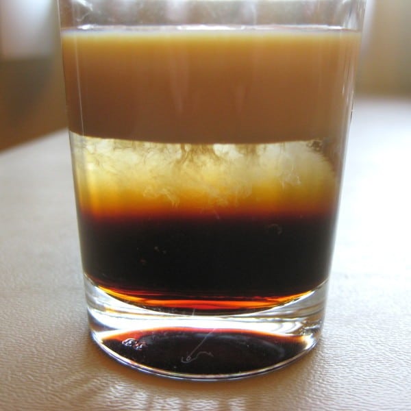 Finished pour showing cloudiness in second layer of cocktail